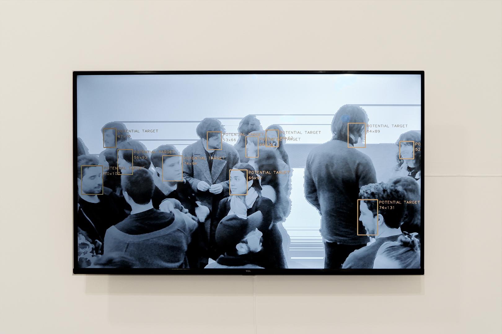 Screen tracking visitors with facial-recognition 'potential target' boxes